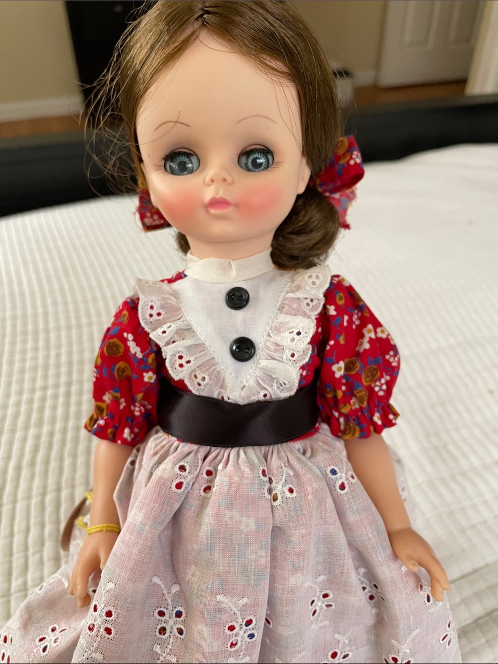 Effanbee Doll FamilyRed Floral Dress Doll with White Eyelet Apron and Brown Sash